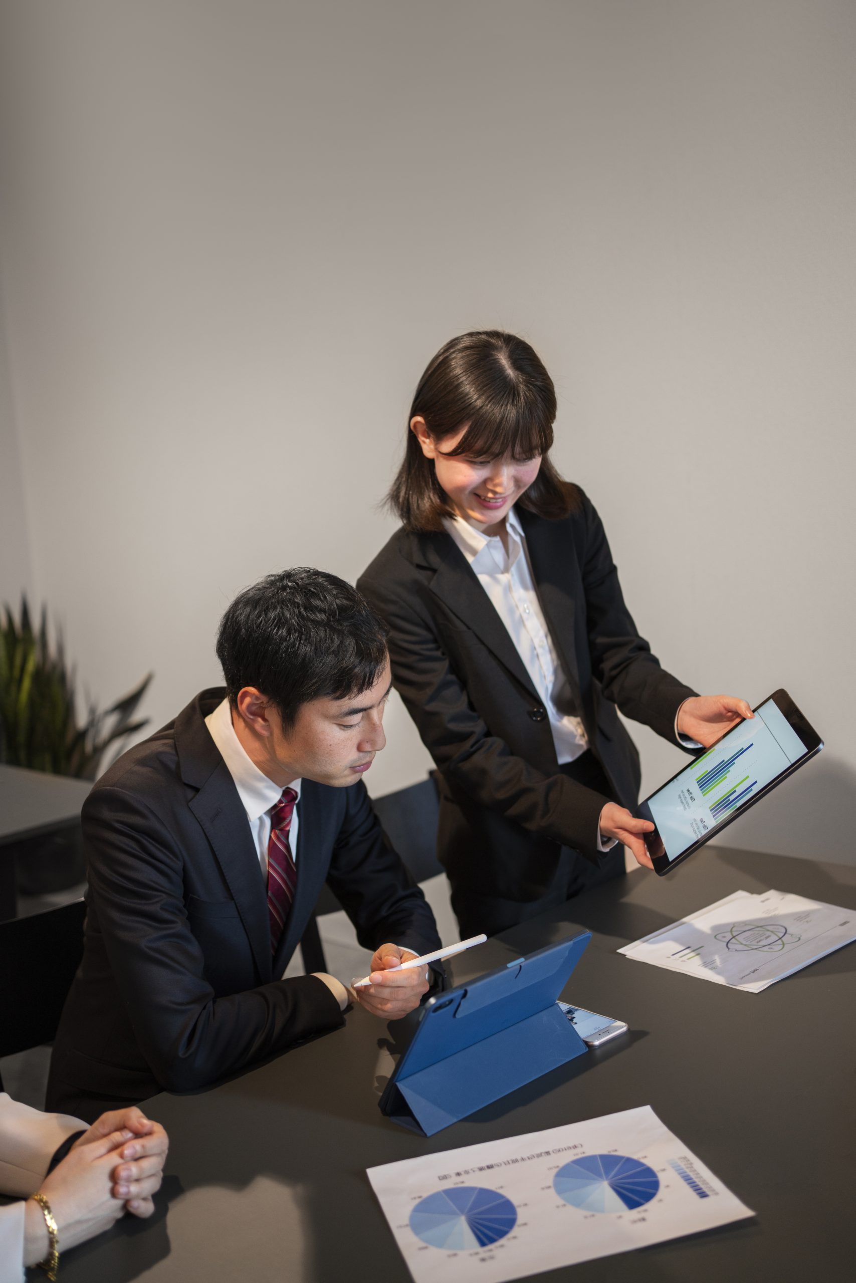 http://syntriollc.com/wp-content/uploads/2025/09/business-people-working-with-ipad-high-angle-scaled.jpg